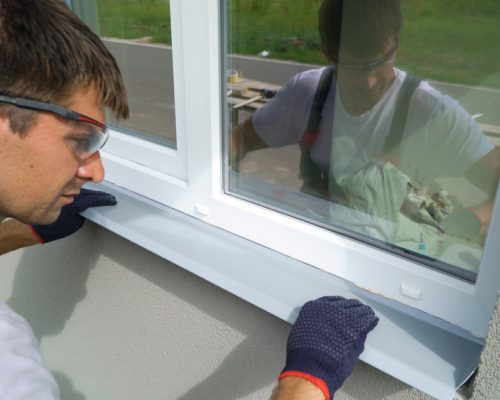 Man,Worker,In,Safety,Glasses,And,Protective,Gloves,Installing,Metal