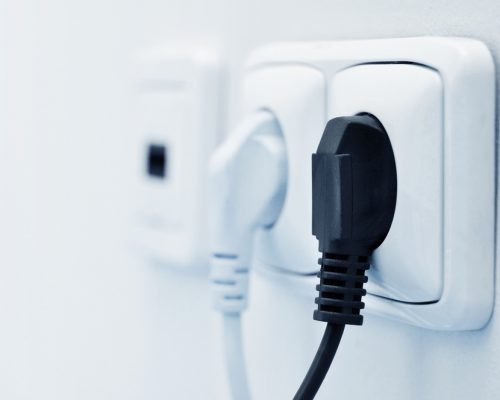 Electric,Plug,In,A,Socket,Closeup.,Small,Shallow,Dof