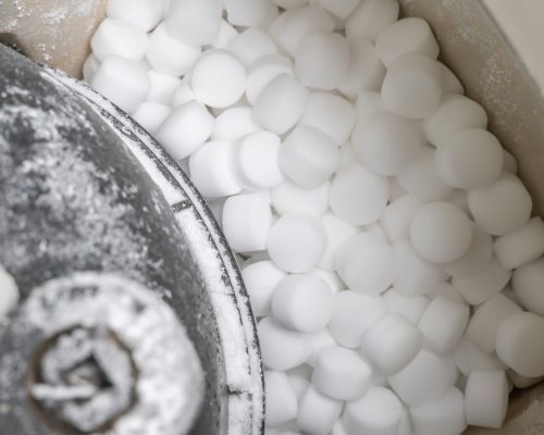 Salt,Pellets,Lies,In,Water,Softener.,Close-up.