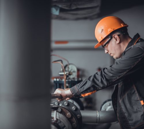 A,Plumber,Engineer,Repairing,Pipes,At,Work