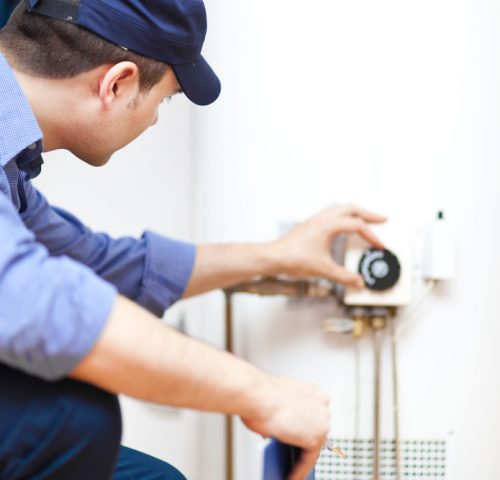 Plumber,Repairing,An,Hot-water,Heater
