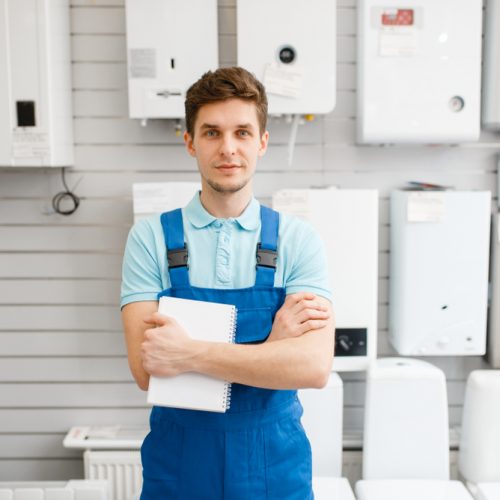 Plumber,At,Showcase,With,Boilers,,Plumbering,Store