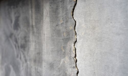 Old,Foundation,And,Plaster,Wall,With,Cracks.,Building,Requiring,Repair