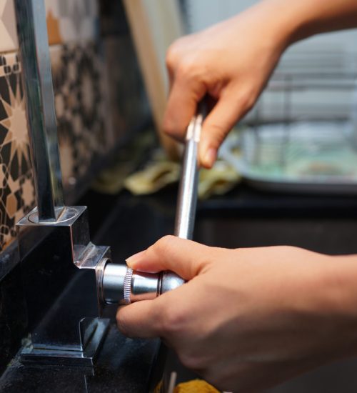 Close-up,Plumber,Hands,Replacement,Tap,Valve.,Kitchen,Faucet,Repair.
