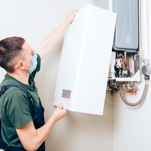 Plumber,Attaches,Trying,To,Fix,The,Problem,With,The,Residential